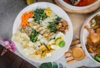 Sajian piring seimbang yang memadukan sumber karbohidrat kompleks, protein lokal, dan sayuran segar sebagai bahan bakar harian tubuh.